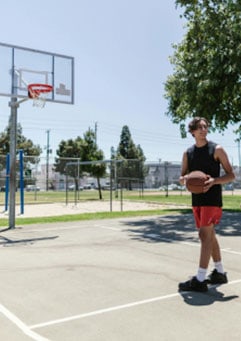 teen-playing-basketball